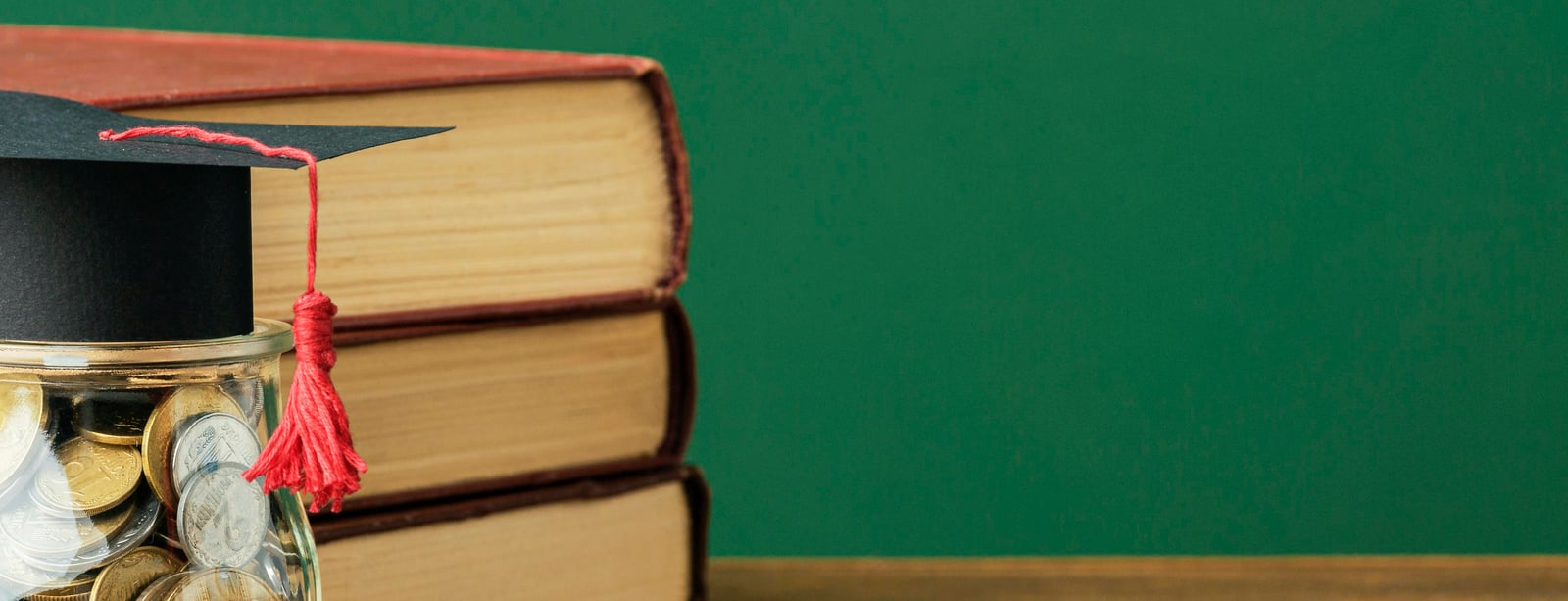 front-view-stack-books-with-copy-space-jar-coins.jpg